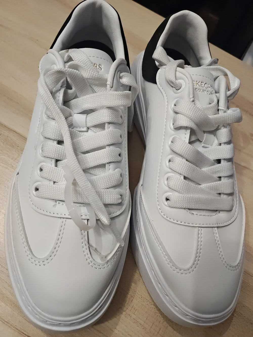 Skechers Men’s White Sneakers with Black Heel Accent 9